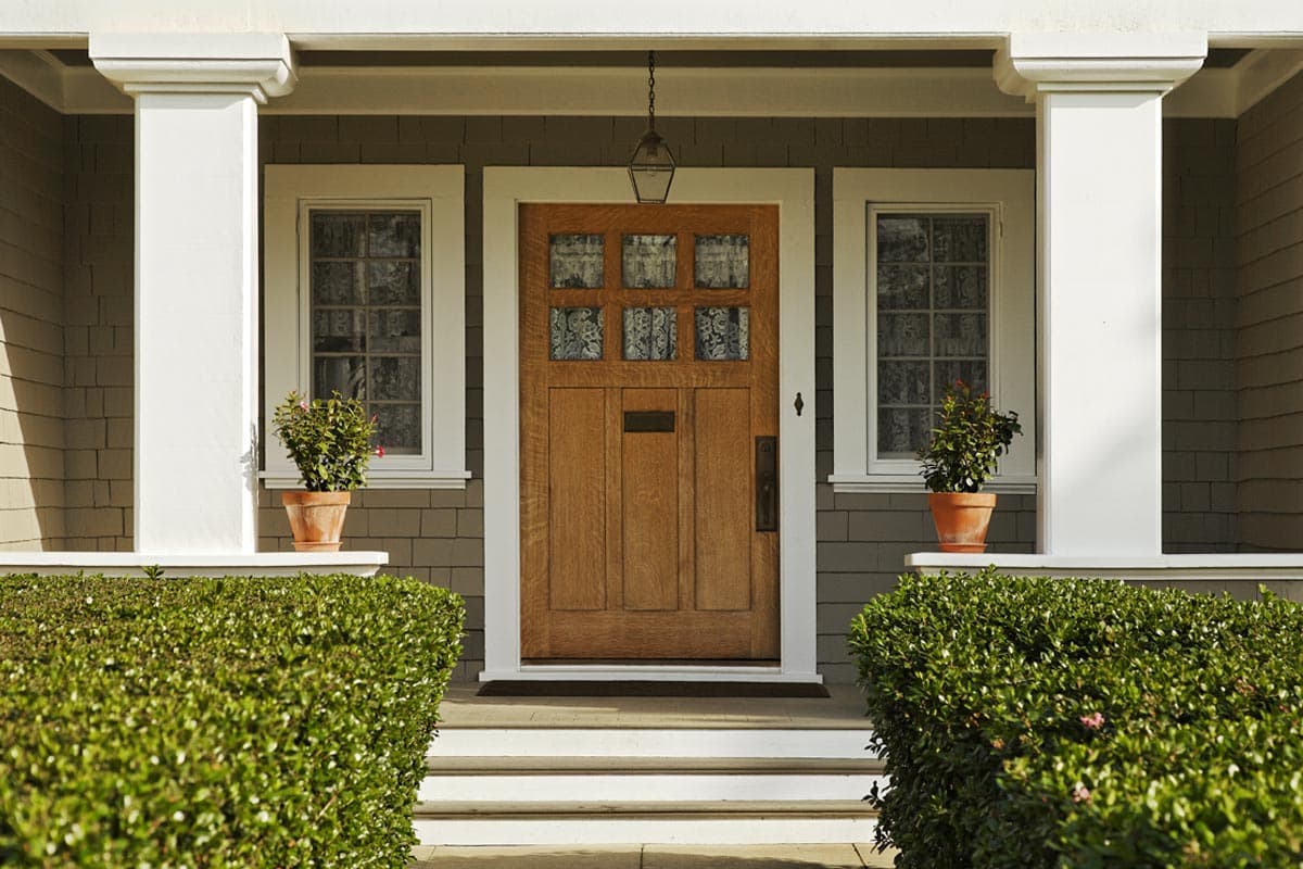 The front door and porch of a residential home.